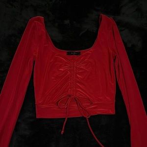 long-sleeve cropped red blouse